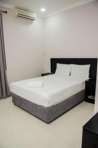 A bed or beds in a room at Residencial Horizonte 2