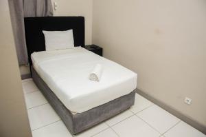 A bed or beds in a room at Residencial Horizonte 2