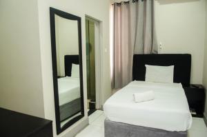 A bed or beds in a room at Residencial Horizonte 2