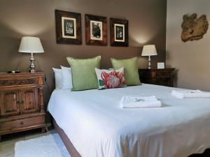 A bed or beds in a room at Excellent Guest House