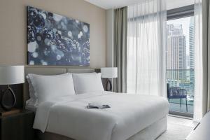 Cama ou camas em um quarto em Jumeirah Living Marina Gate Dubai