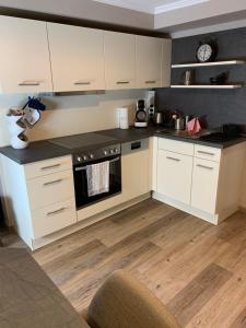 Una cocina o kitchenette en African Suite - Maintal bei Frankfurt