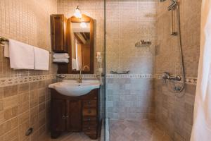 a bathroom with a sink and a shower at Apartments Bazar in Ulcinj