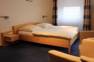 Łóżko lub łóżka w pokoju w obiekcie Hotel Reiff