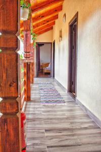 a hallway of a house with a wooden floor at Pensiunea Mariana in Ocna Şugatag