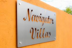 Un certificado, premio, letrero u otro documento en Navigator Villas - Houses