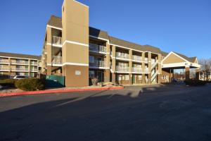 an empty street in front of a building at HomeTowne Studios by Red Roof Denver - Lakewood West in Lakewood