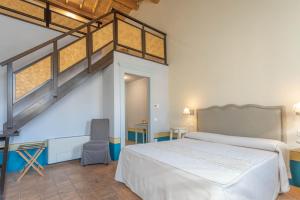 A bed or beds in a room at Aquae Sinis Albergo Diffuso