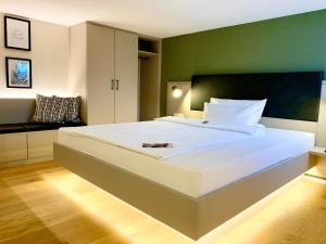 Tempat tidur dalam kamar di zeitwohnhaus SUITE-HOTEL & SERVICED APARTMENTS