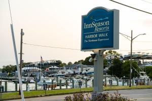 a sign for the intersession repairs harbor walk at a marina at InnSeason Resorts HarborWalk in Falmouth