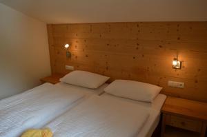 Cama ou camas em um quarto em Chalet Regina