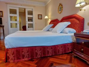 Giường trong phòng chung tại Hotel Alameda Palace