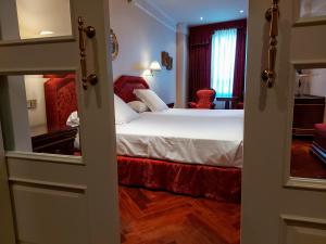 Giường trong phòng chung tại Hotel Alameda Palace