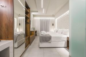 Giường trong phòng chung tại Litore Luxury Living