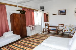 Una cama o camas en una habitación de Hotel Karpathos