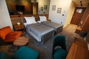 Cama ou camas em um quarto em New City Hotel & Restaurant Niš