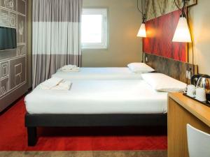 เตียงในห้องที่ Ibis Sheffield City