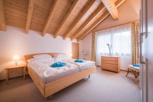 Cama ou camas em um quarto em Apartment Lauberhorn, Luxury with best views