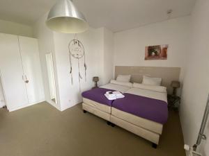 Una cama o camas en una habitación de De Slaapfabriek vakantiehuis en trainingslocatie