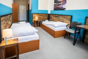 A bed or beds in a room at Hotel VP1