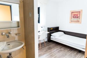 Cama ou camas em um quarto em City Hostel Geneva