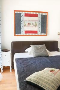 a bedroom with a bed with a blue comforter at A La Villa Boucicaut in Chalon-sur-Saône