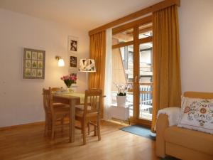 a living room with a table and chairs and a dining room at Appartement Gurgl in Obergurgl