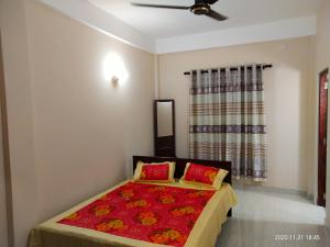 Cama ou camas em um quarto em Victory's Residence, Mannar