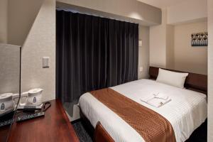 HOTEL BRILLER Kyoto Station South房間的床