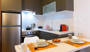 A kitchen or kitchenette at Elounda Colour Apartments