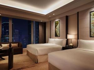 Fairmont Chengdu में एक कमरे में एक या कई बेड