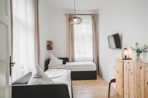 Llit o llits en una habitació de Apartmány Natálie