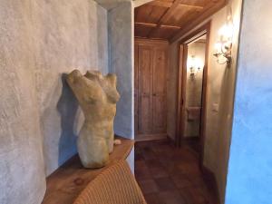 a statue sitting on a table in a hallway at Beautiful apartment over the mountain in Crans-Montana