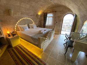 Voodi või voodid majutusasutuse Mimi Cappadocia Luxury Cave Hotel toas