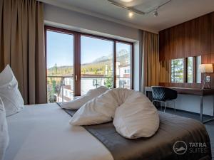 Posteľ alebo postele v izbe v ubytovaní TATRA SUITES Luxury Studio A305