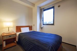 Posteľ alebo postele v izbe v ubytovaní Hotel First Stay Amagasaki