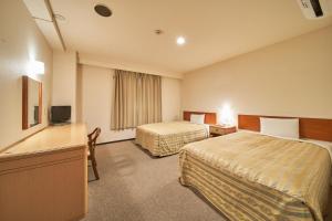 Posteľ alebo postele v izbe v ubytovaní Hotel First Stay Amagasaki