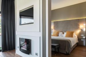 Rúm í herbergi á Sevilla Green Suites