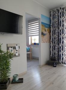 TV i/ili multimedijalni sistem u objektu Maritime Apartment