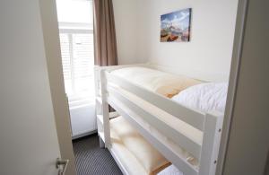 Una cama o camas en una habitación de Apartment Eisberg 6 mit Balkon