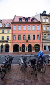 a group of bikes parked in front of a building at Le Baldinger Boutique Hotel in Bamberg