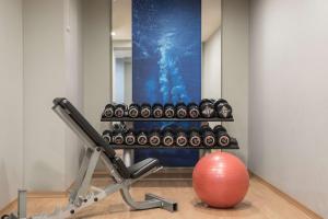 a room with a gym with a exercise ball at Scandic Gdańsk in Gdańsk