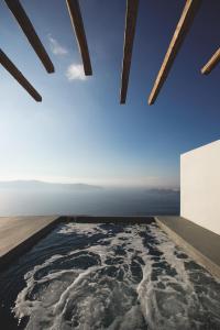 a room with a view of the ocean at Remezzo Villas in Imerovigli