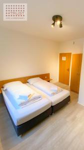 Cama ou camas em um quarto em 24-7 Stadthotel Stuttgart