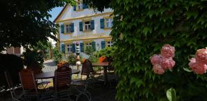 a table and chairs in front of a building at Landgasthof Hotel Rittmayer in Hallerndorf