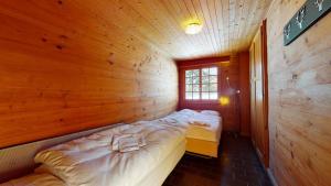 Кровать или кровати в номере Apartment at the bottom of the slopes in Crans-Montana, cosy atmosphere