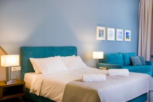 A bed or beds in a room at Elounda Colour Apartments