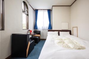 Cama ou camas em um quarto em Kinugawa Pension Bamboo