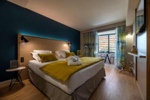 Кровать или кровати в номере Best Western Montecristo-Bastia