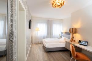 Krevet ili kreveti u jedinici u okviru objekta Hotel Krone ****S